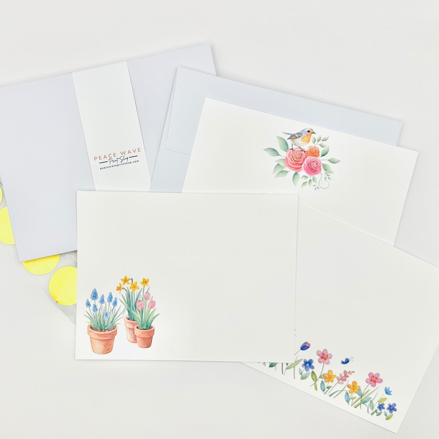 Set of greeting cards with floral designs on a white background plus coordinating envelopes and gold sticker seals