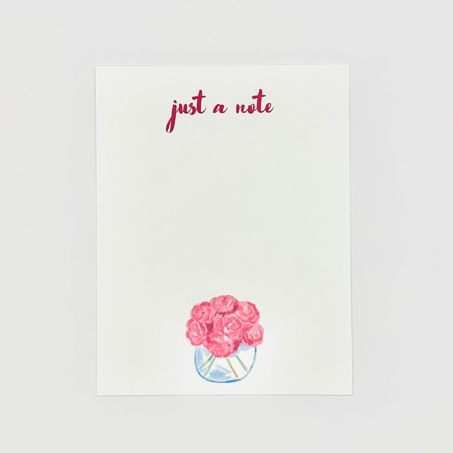 Stationery note card with pink roses and 'just a note' text on a white background