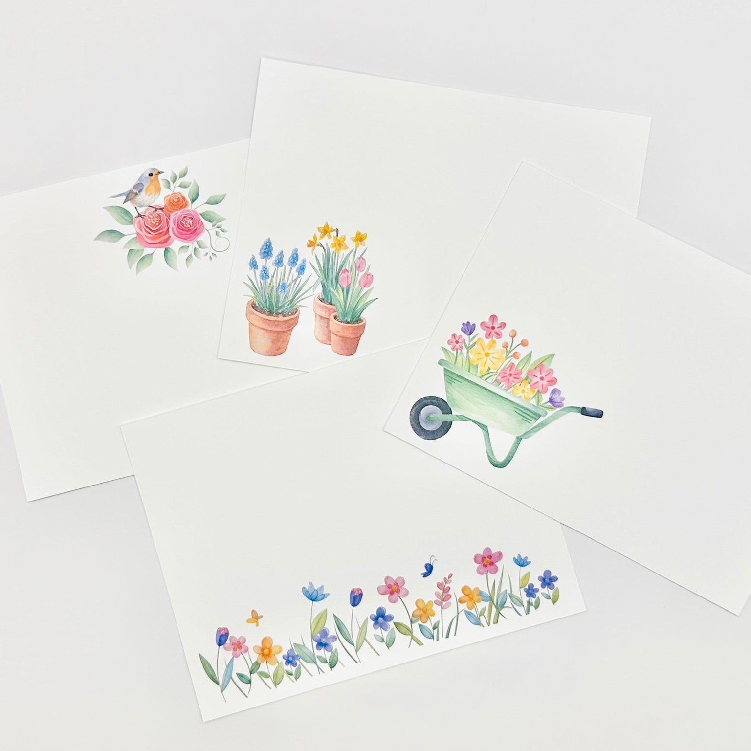Set of flat stationery cards with floral designs on a white background